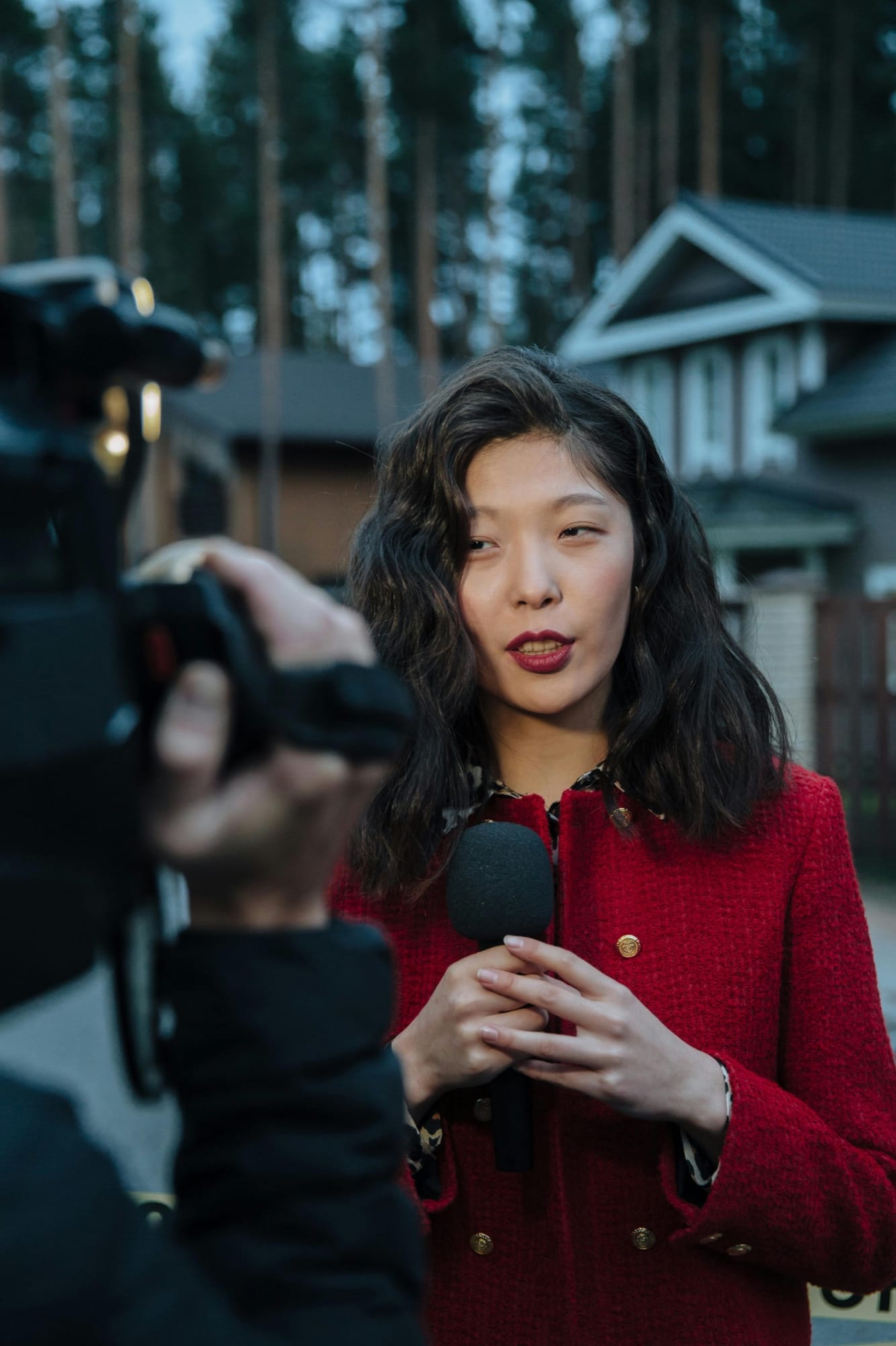 A reporter holding a microphone during an interview